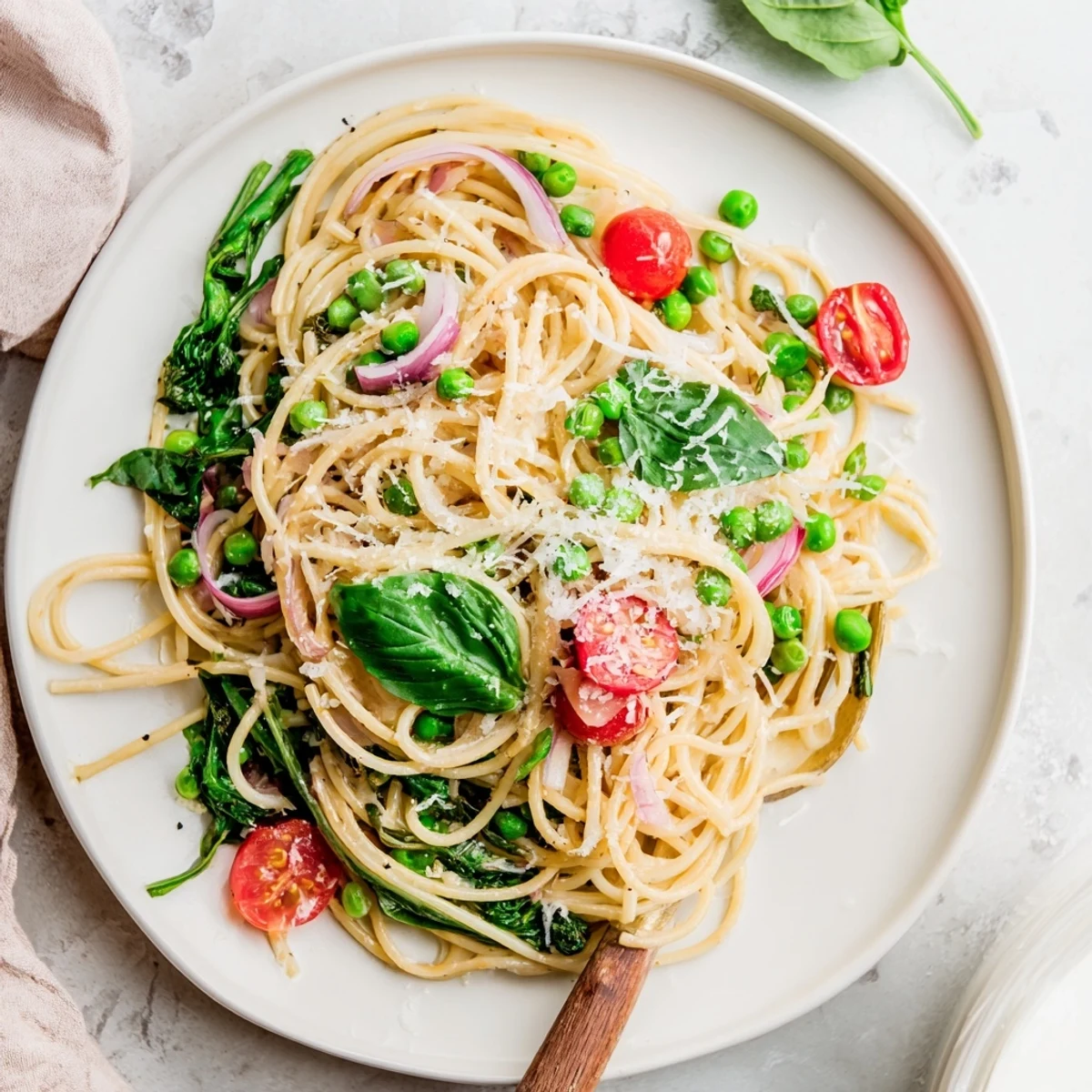 A steaming bowl of Spring Veggie One-Pot Spaghetti ready for a weeknight vegetarian dinner.