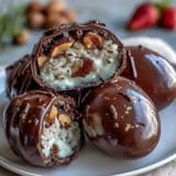 Dubai Chocolate Strawberry Easter Eggs with Crunch Filling: golden eggs filled with strawberry white chocolate and a crunchy hazelnut crisped rice center.