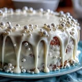 A beautifully moist and tender sheet cake, elegantly decorated with smooth pearl fondant—a perfect centerpiece for a First Communion celebration.  