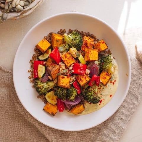 Golden roasted vegetables atop fluffy farro in this delicious Hearty Roasted Vegetable and Farro Grain Bowl.