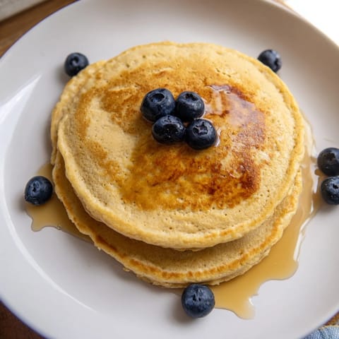 Fluffy three-ingredient Protein Banana Pancakes, cooked to perfection, ready to be enjoyed.