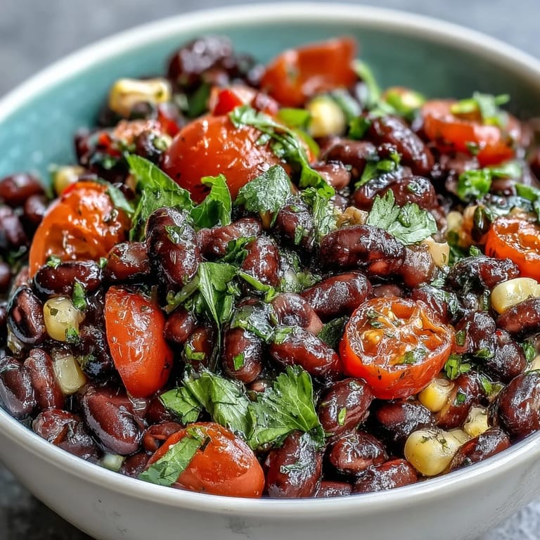 Vibrant Tex-Mex Cowboy Caviar with tomatoes and onions, ready to enjoy chilled or as a taco topping.