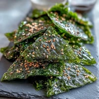 Crispy seaweed snack chips with sesame seeds, brushed with sesame oil.